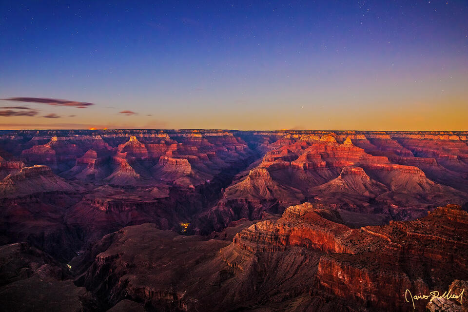 Nautical Sunset over the Grand Canyon as day transitions to night. The stars begin to shine and the last light of day begins to fade above Mather Point.