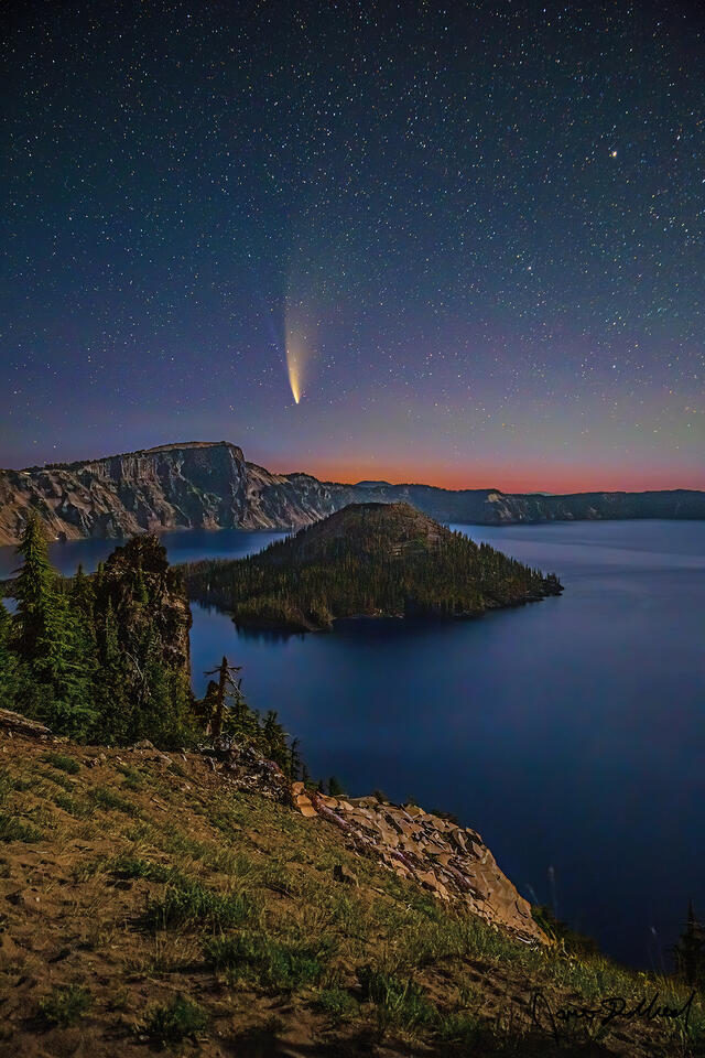 Diffuse aurora borealis illuminates the skies over moonlit Crater Lake and Wizard Island at Discovery Point, as Comet NEOWISE streaks through the night sky.