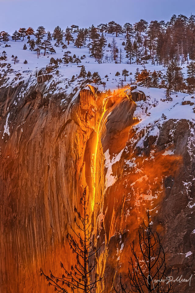Sunset lights the waters of Horsetail Fall orange like Lava as the Yosemite Firefall comes to life.
