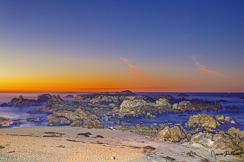 The stars begin to come out as the last light from the long past sunset hangs on as Nautical Twilight sets in over Pacific Ocean and the rugged Pacific Coast.