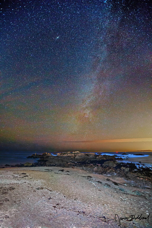 The Milky Way rises high into the night sky over the Pacific Ocean and Big Sur in Northern California during the Winter Solstice.