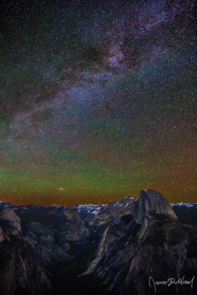 The Milky Way and Andromeda Galaxy rise into the night sky above Half Dome, Quarter Domes, Basket Dome, Mount Watkins, Tenaya Canyon and Cloud's Rest.