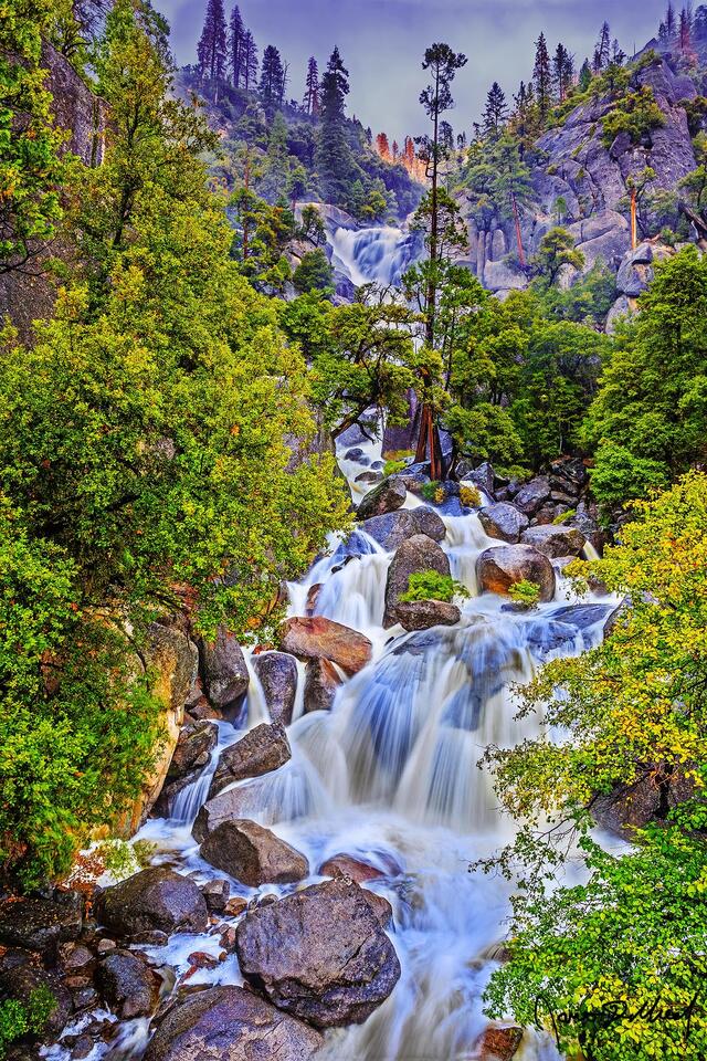Cascade Falls (also known as The Cascades) combines with Tamarack Creek as its upper tiers plunge down the cliffs towards Merced Canyon below.