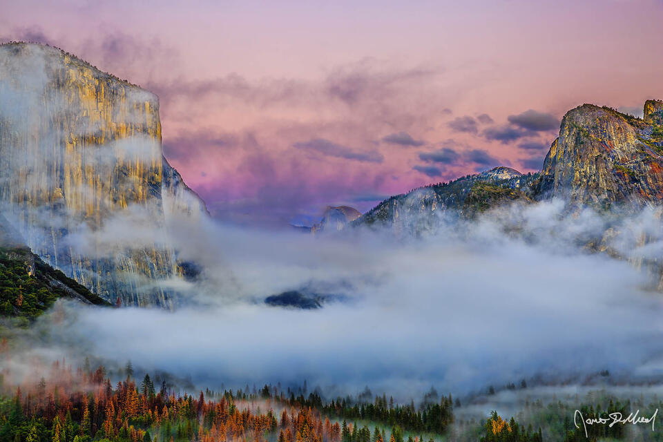 Alpenglow above Tunnel View and Yosemite Valley as fogs rolls in. Cathedral Rocks and El Capitan frame Half Dome as it rises up out from the fog.