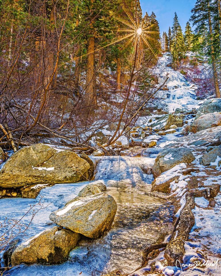 The setting sun peaks through the trees as the waters along Lone Pine Creek and Lone Pine Creek Falls (also known as Whitney Portal Falls) lay still and frozen.
