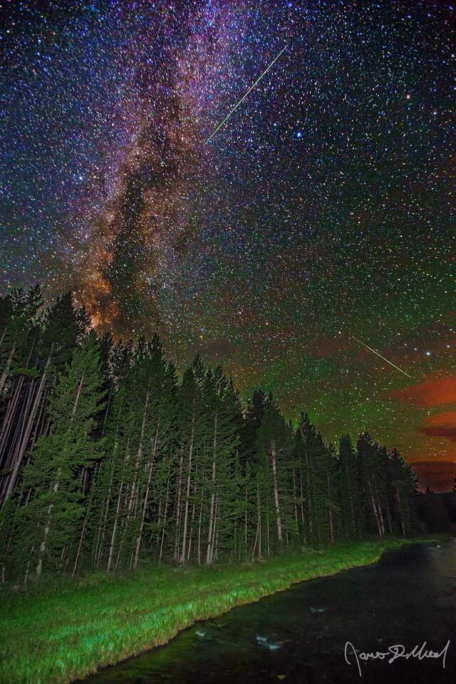 The Milky Way Core rises high into the sky above Nez Perce Creek in Yellowstone National Park as Perseid Meteors streak across the sky.