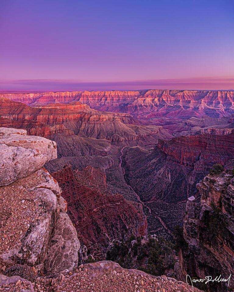 Alpenglow illuminates the skies over the Grand Canyon, Unkar Creek and the Colorado River pastel colors, illuminating the Palisades of the Desert.