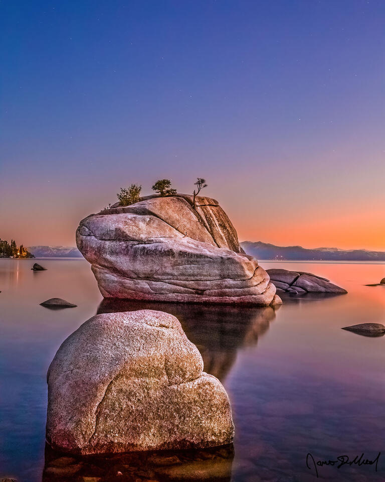 Pastel colors bathe the skies above Bonsai Rock and Lake long after sunset has passed, nautical twilight sets in and the first stars of night begin to appear.