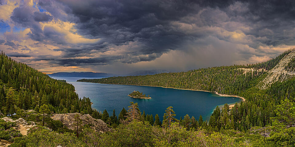 Storm clouds over Lake Tahoe and Emerald Bay form a Squall Line as thunderstorms bring heavy rain to the area while South Lake Tahoe sits under a flood watch.