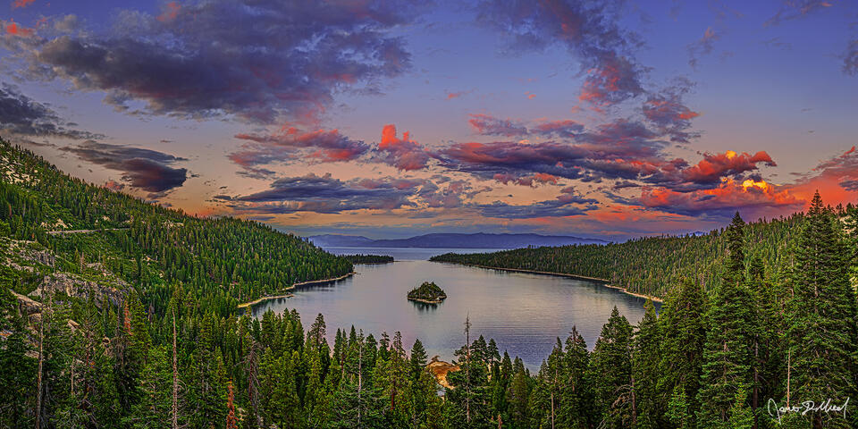 The soft, pastel colors of sunset light the skies over Emerald Bay and Lake Tahoe after a storm clears.