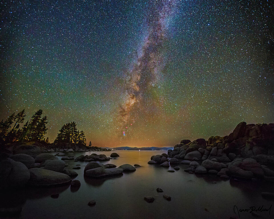 The Milky Way rises high into the sky above a Rocky Cove at Sand Harbor on Lake Tahoe.