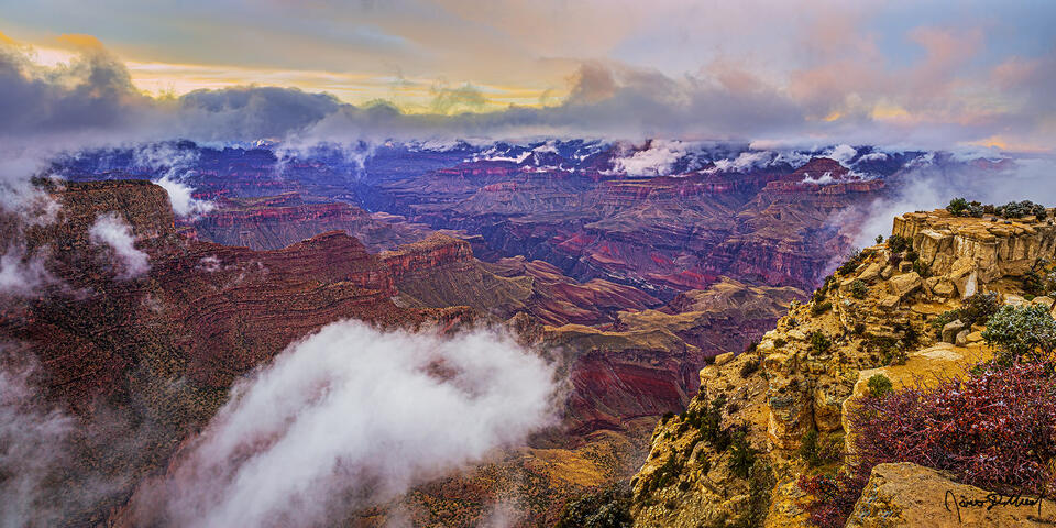 A partial thermal inversion begins to form in the Grand Canyon at Sunset above the Colorado River and the inner canyon far below.