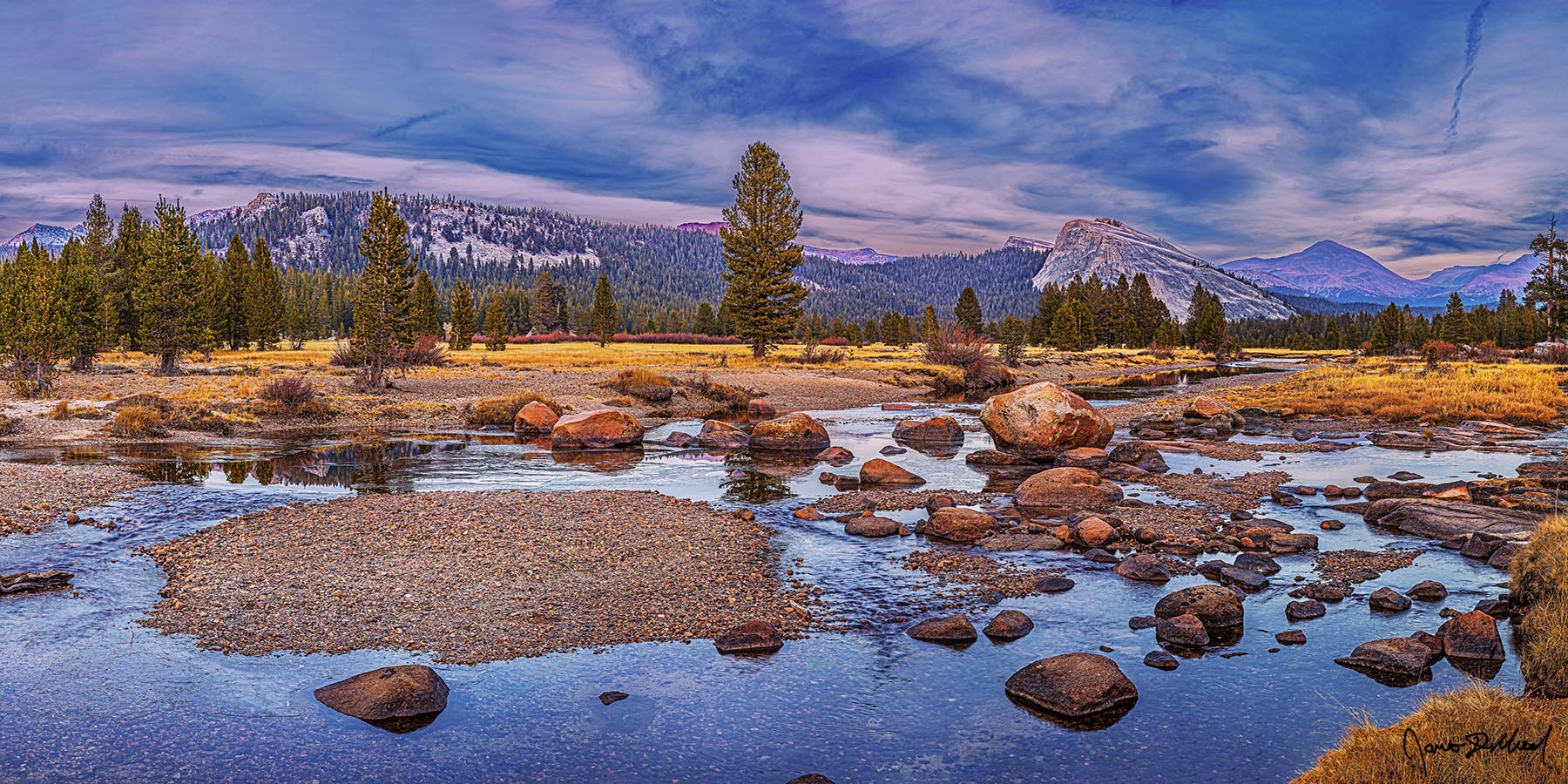 Endless Storm clouds gather over Tuolumne Meadows and the Tuolumne River as Lembert Dome, Dog Dome, Mount Dana and Mount Gibbs rise high above glacial erratics