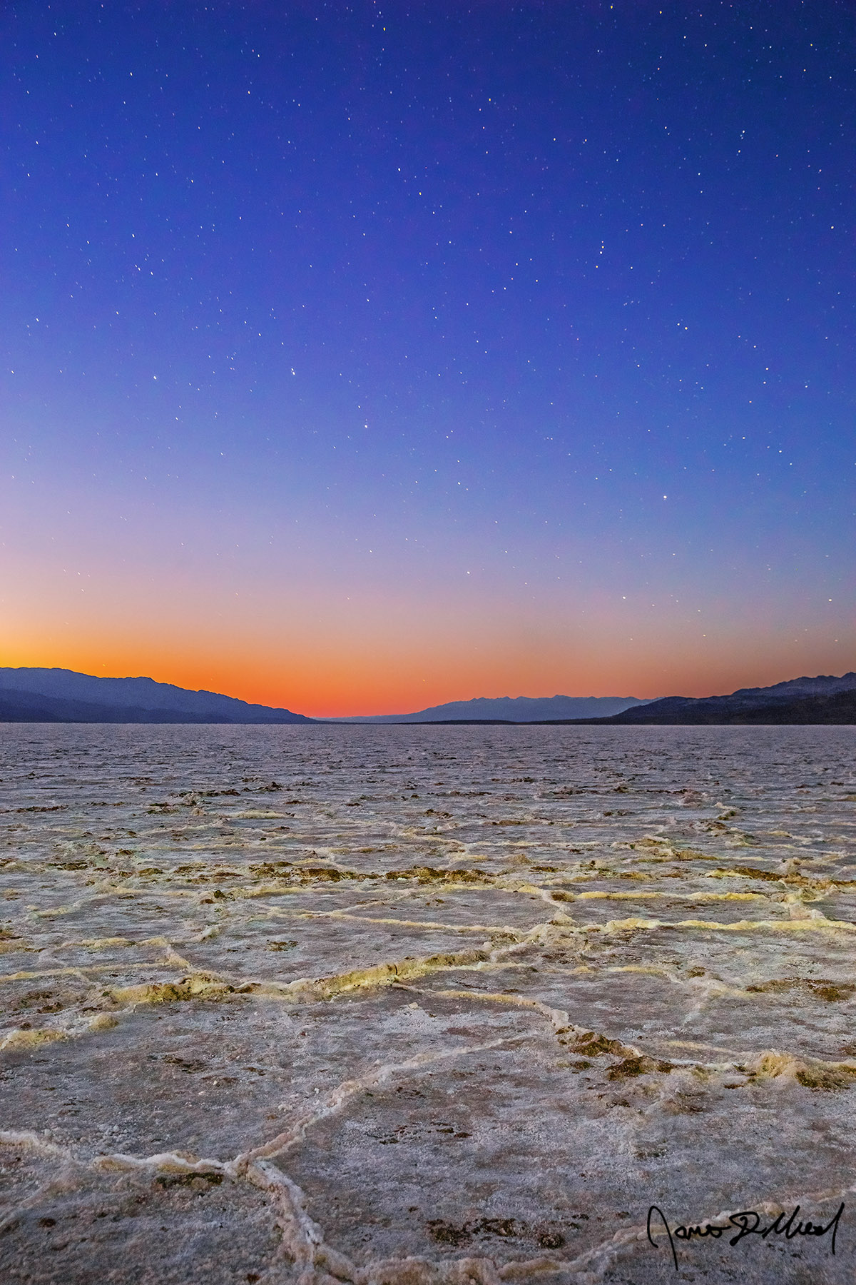 Zenith - Nautical Sunset over Badwater Basin Salt Hexagons, Death Valley National Park, California Dried salt forms hexagonal shaped geometric patterns in the Badwater Basin in Death Valley. The last remaining light from sunset fades away at nautical twilight