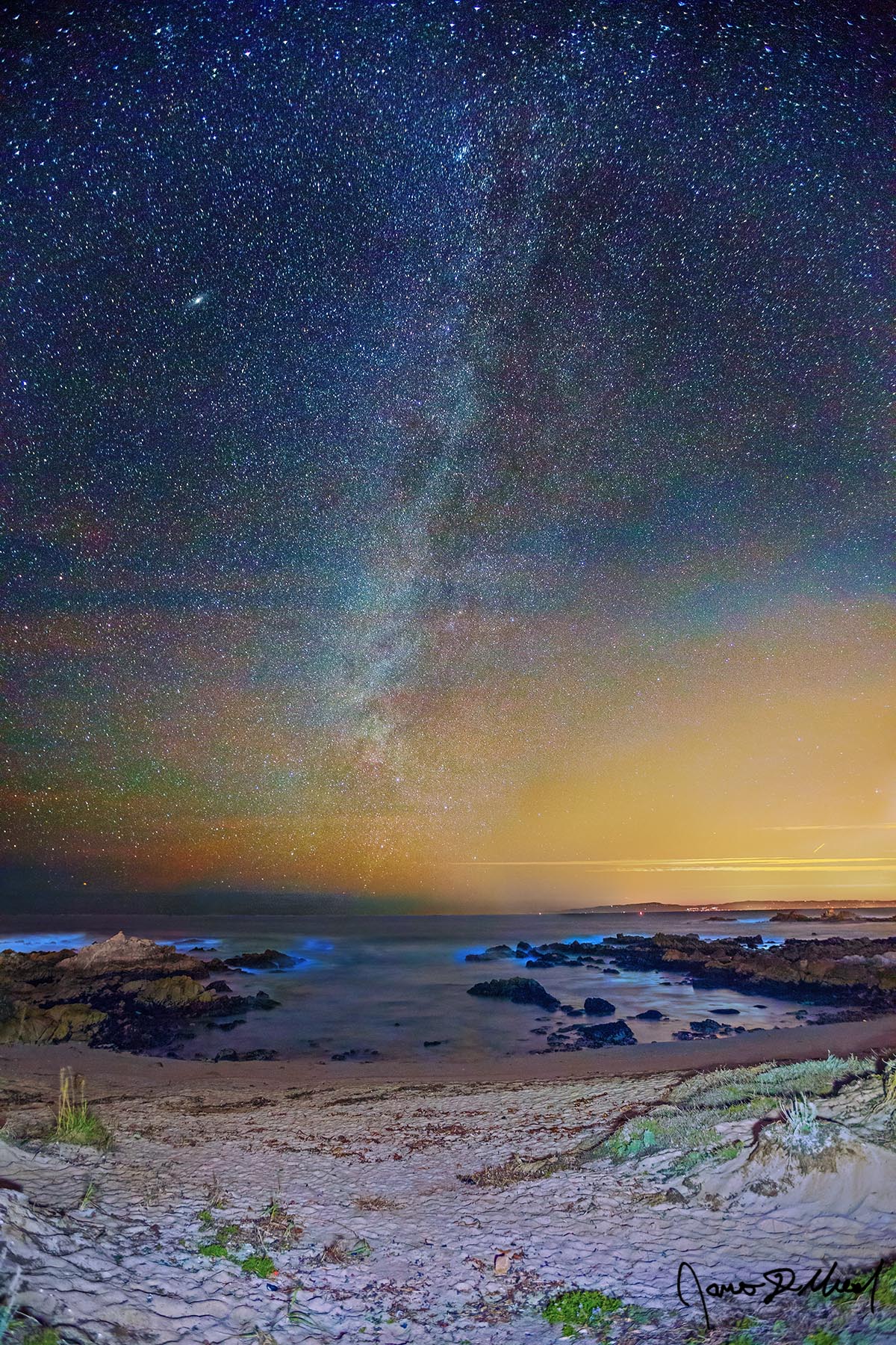 Winter Solstice in the Cove - Milky Way, Bioluminescence and Pacific Ocean at Monterey Bay The Milky Way shines bright in the sky over the Pacific Ocean on the Winter Solstice.