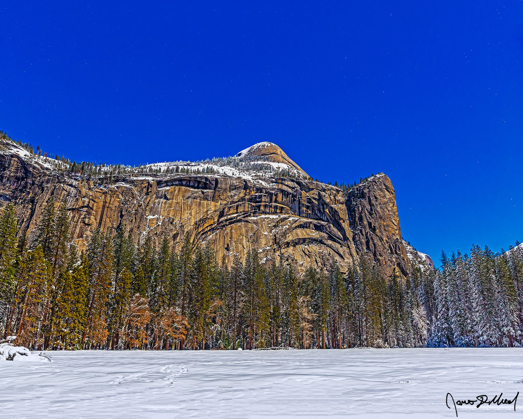 Moonlight Magic Moonlight illuminates North Dome, Royal Arches, Royal Arch Cascades, Washington Column above snow covered Stoneman Meadow and Yosemite Valley.