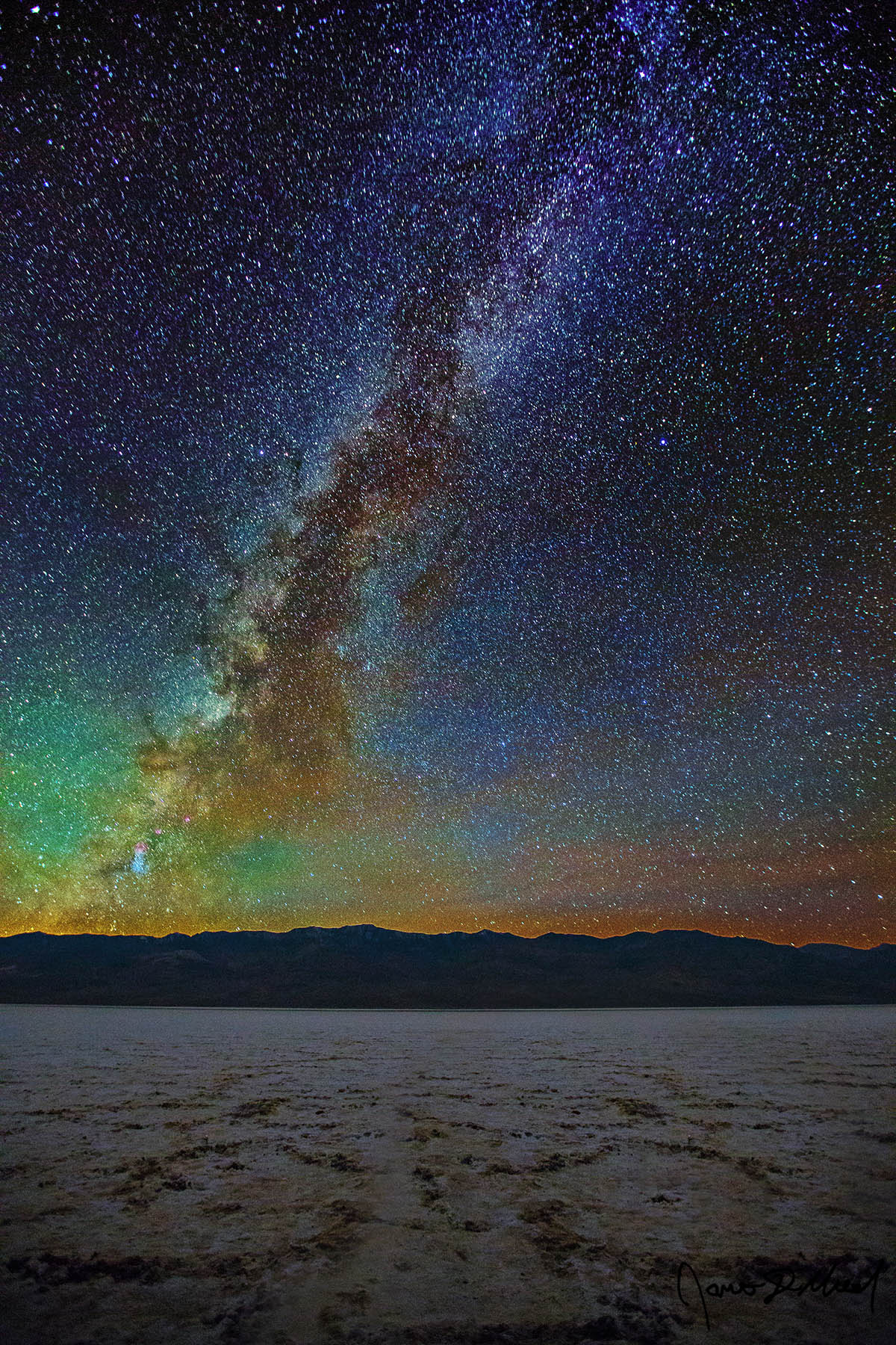 Badwater Destruction - The Milky Way over Badwater Basin after Lake Manly Receded, Death Valley, CA Receding flood waters reveal the destruction of the salt formations in Badwater Basin as the Milky Way rises high into the sky above Death Valley National Park.