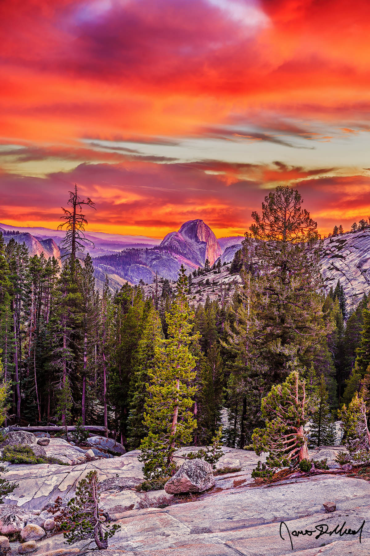 Artist's Canvas Sunset bathes skies above in brilliant light as alpenglow illuminates Half Dome, Quarter Domes, Tenaya Canyon in Yosemite near Olmstead Point.