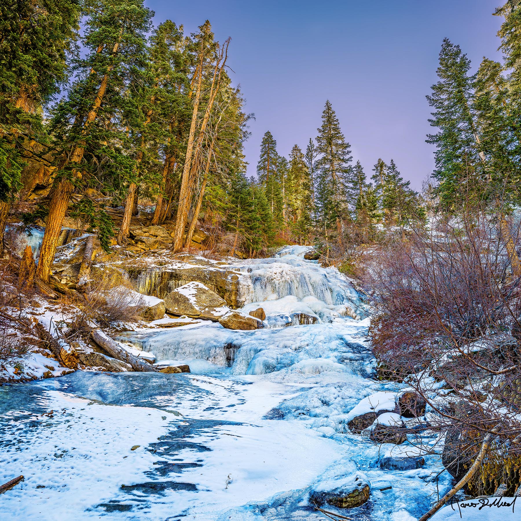 Frozen Lone Pine Creek Falls (also known as Whitney Portal Falls) and Lone Pine Creek freeze over as winter sets in at Whitney Portal high up in the Sierra Nevada.