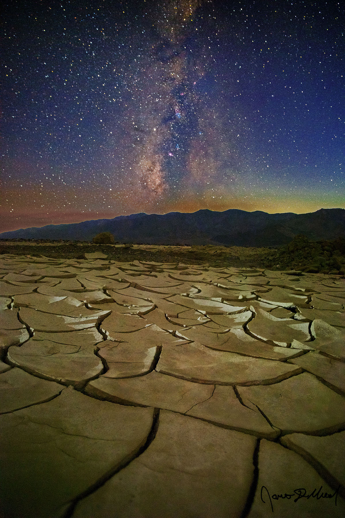 Split Eternity - Milky Way over the Death Valley Mud Cracks and Telescope Peak, Death Valley, CA Deep cracks form in the dried mud beds of Death Valley as the Milky Way rises into the night skies overhead.