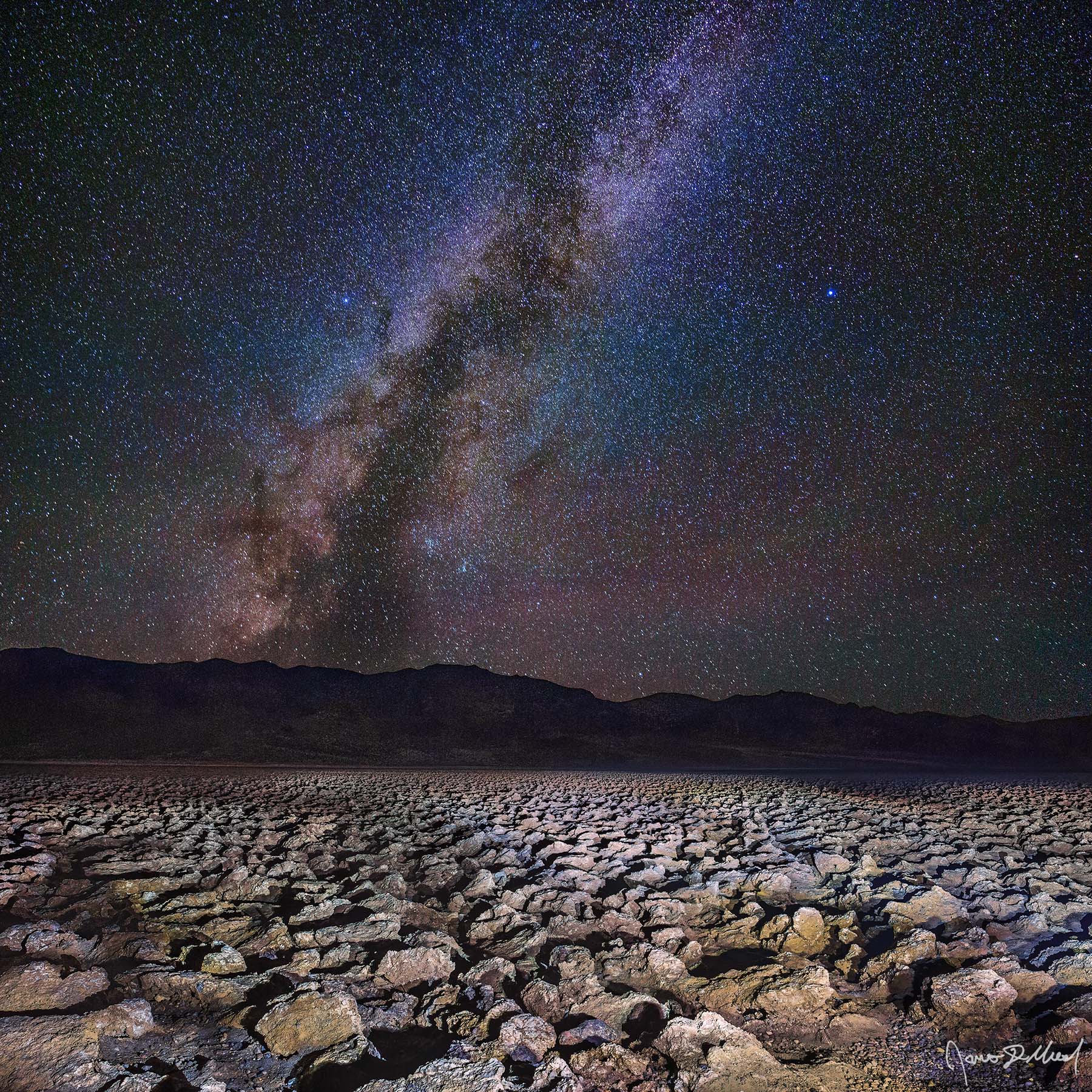 Cracked Starlight - The Milky Way over Devils Golf Course and the Panamint Range, Death Valley, CA The Milky Way spiral arm rises high into the skies above Devils Golf Course Salt Pan in Death Valley National Park