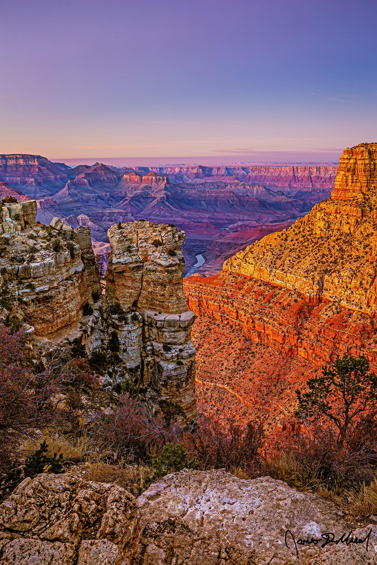 Interlude - Sunset over Moran Point, the Colorado River and the Grand Canyon The warm glow of sunset bathes the buttes and temples of the Grand Canyon at sunset as the pastel colors of the Belt of Venus illuminate the skies above.