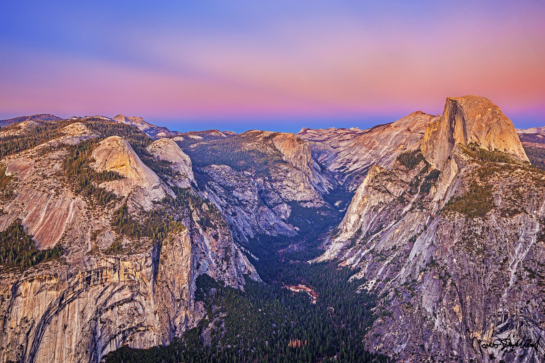 Believe The Belt of Venus begins to show just after sunset as alpenglow sets in over Half Dome, North Dome, Basket Dome, Royal Arches, Mount Watkins, and Clouds Rest.