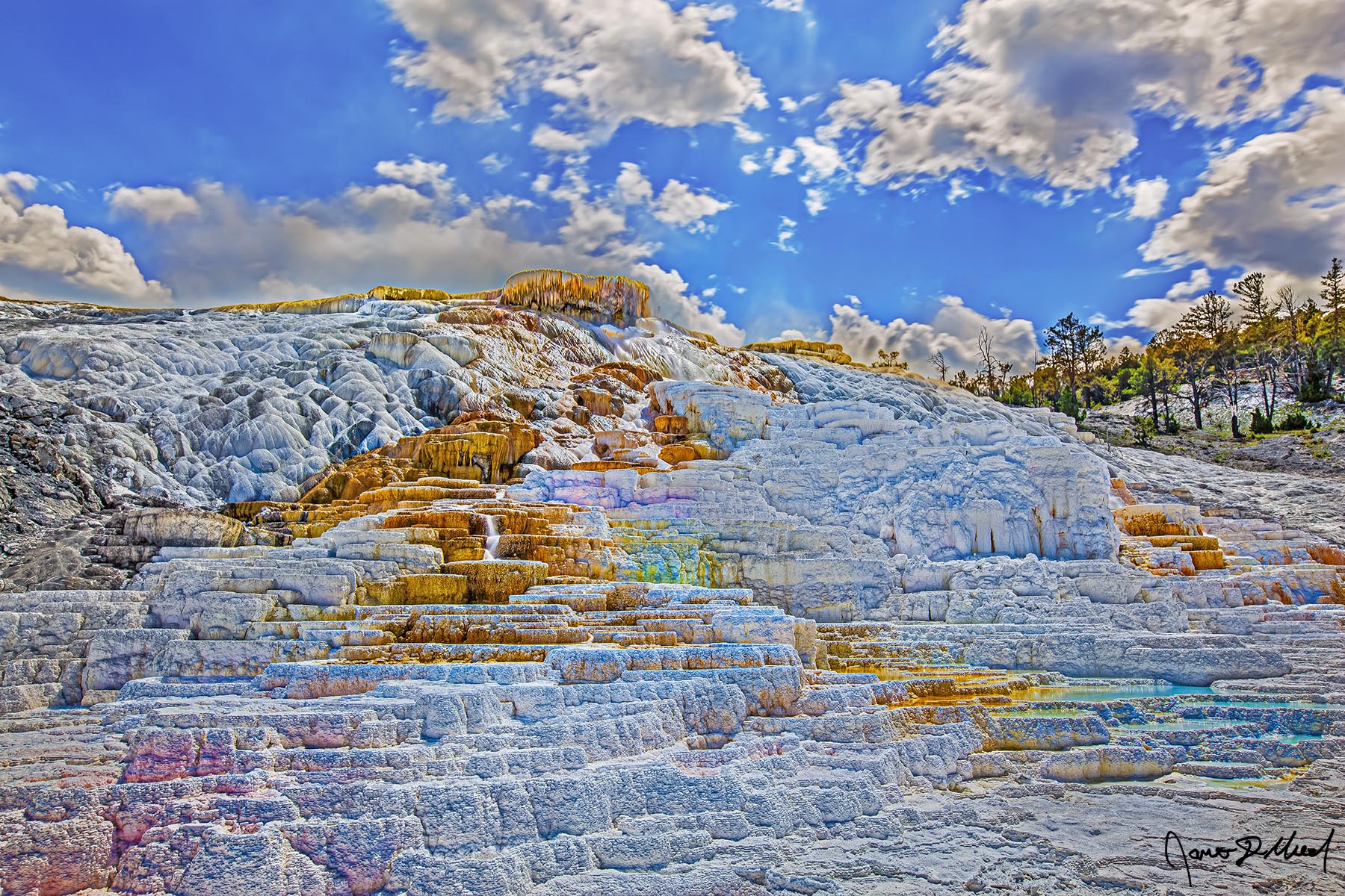 Color Palette Water flows down the hillside creating a palette of colors where different types of heat-resistant bacteria thrive.