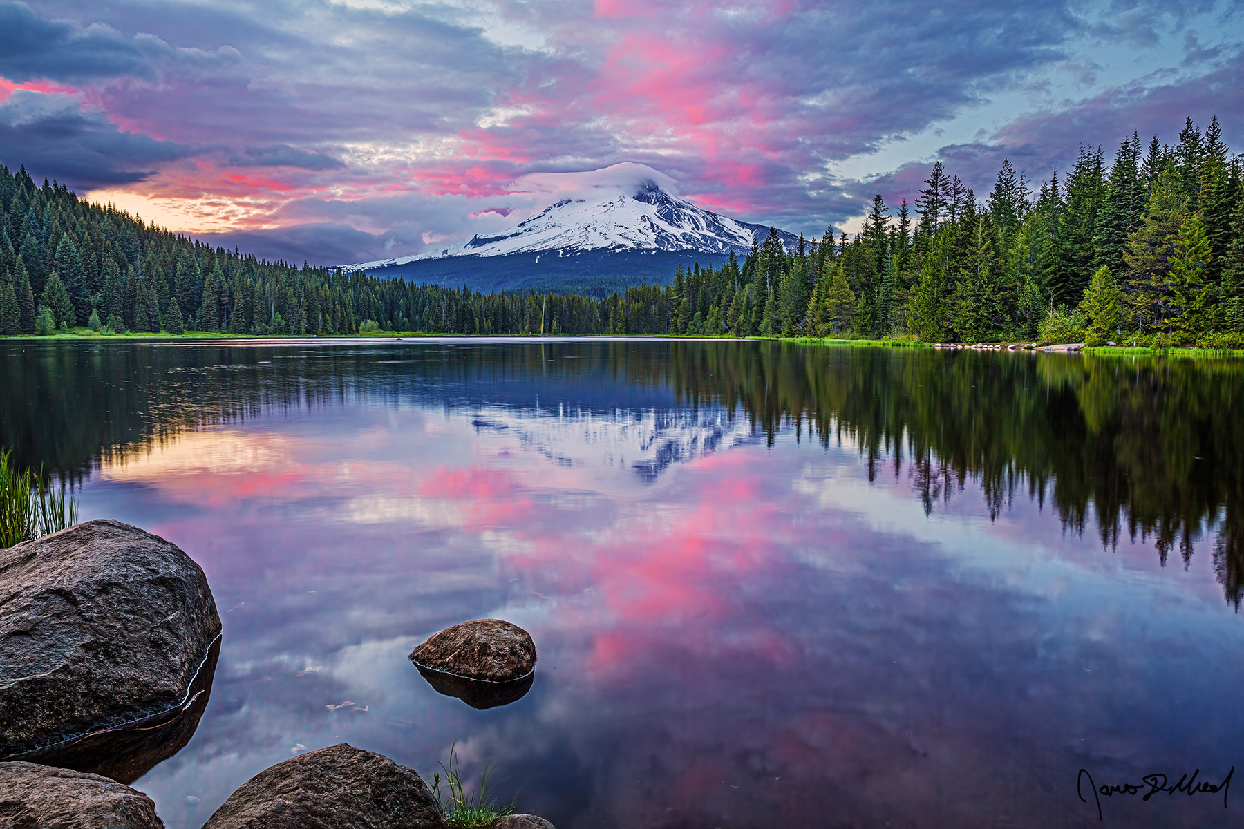 Guardian of the Lake - Mount Hood Lenticular Cloud Sunset and Trillium Lake Reflections A lenticular cloud crowns the peak of Mount Hood just after sunset as alpenglow illuminates the clouds above while rocks guard the shores of Trillium Lake.