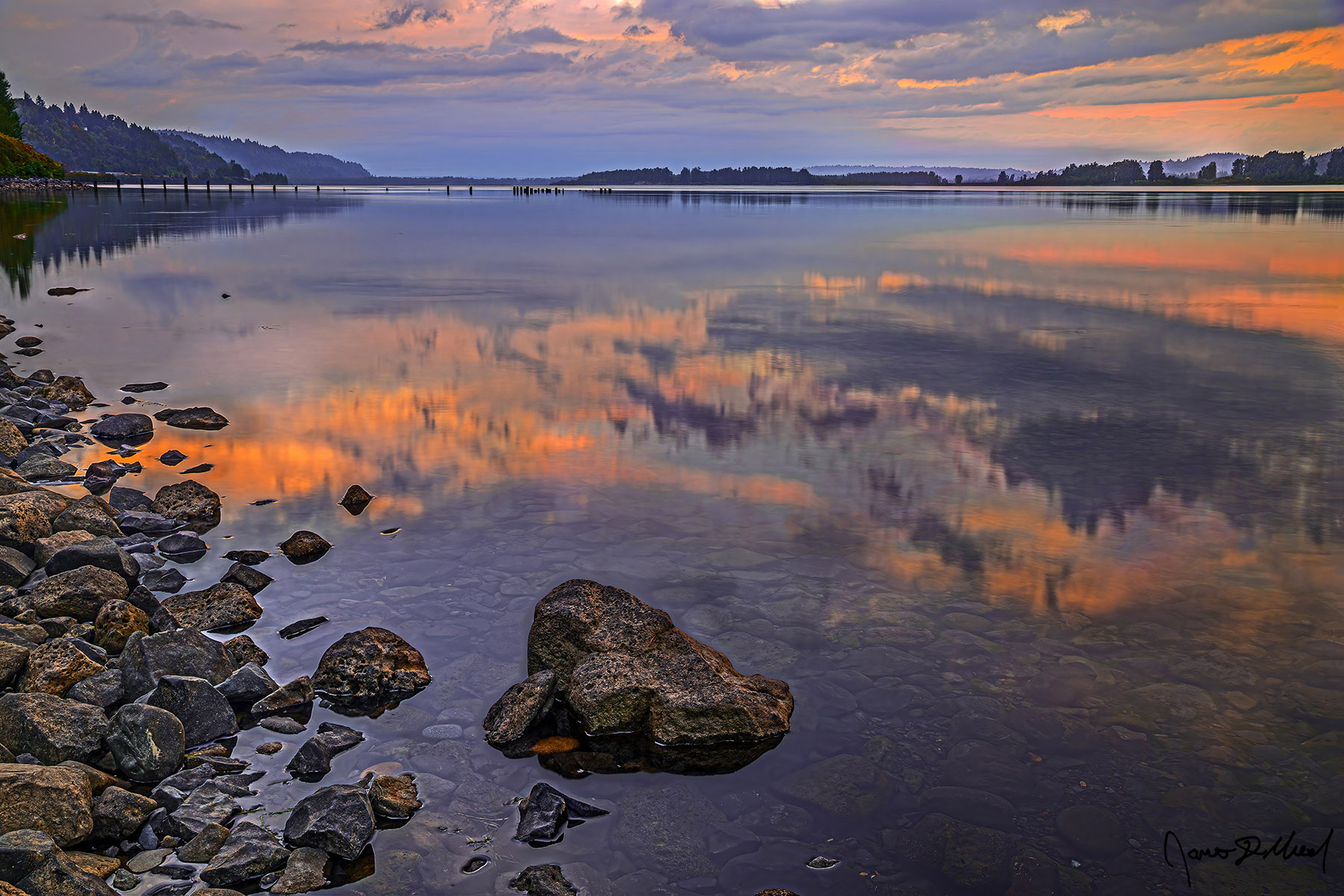 Mirror Runner - Sunset Mirror Reflections in the Columbia River, Columbia River Gorge, Oregon Sunset illuminates the clouds in the sky above as it reflects like a mirror in the still, see through waters of the Columbia River in the Columbia River Gorge.