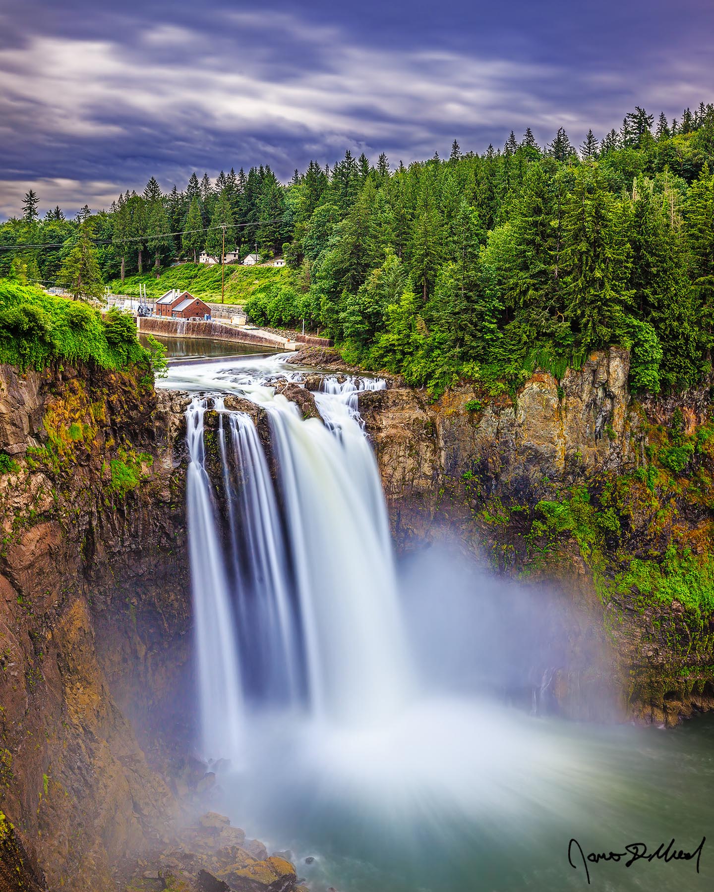 Falling into the Mist Mist flies up as the waters of the Snoqualmie River crash against the rocks as Snoqualmie Falls drops 268 feet over the cliffs and into a pool water.