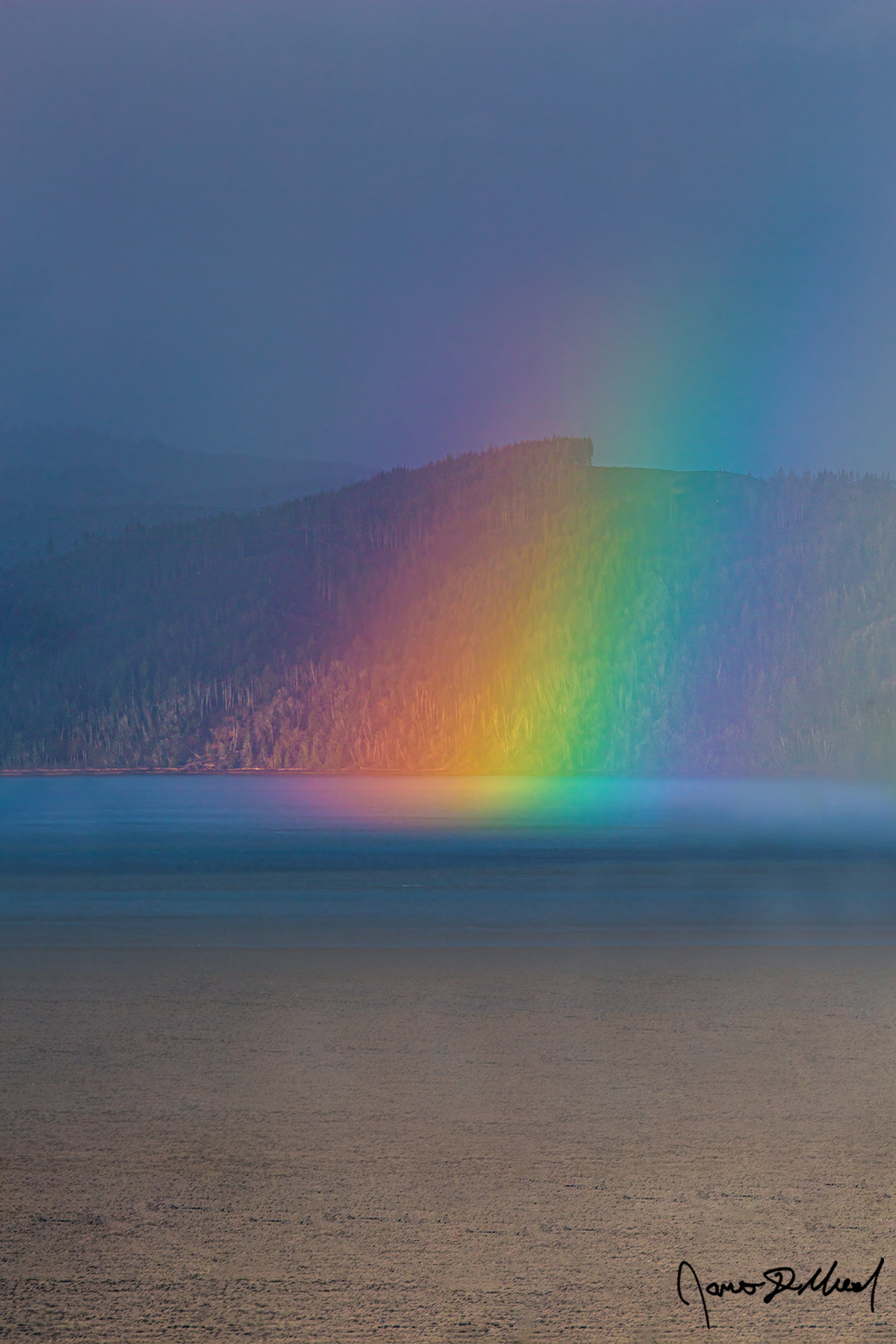 Prism A rainbow shines through a parting storm across the mouth of the Columbia River in Astoria, Oregon on the Oregon Coast.