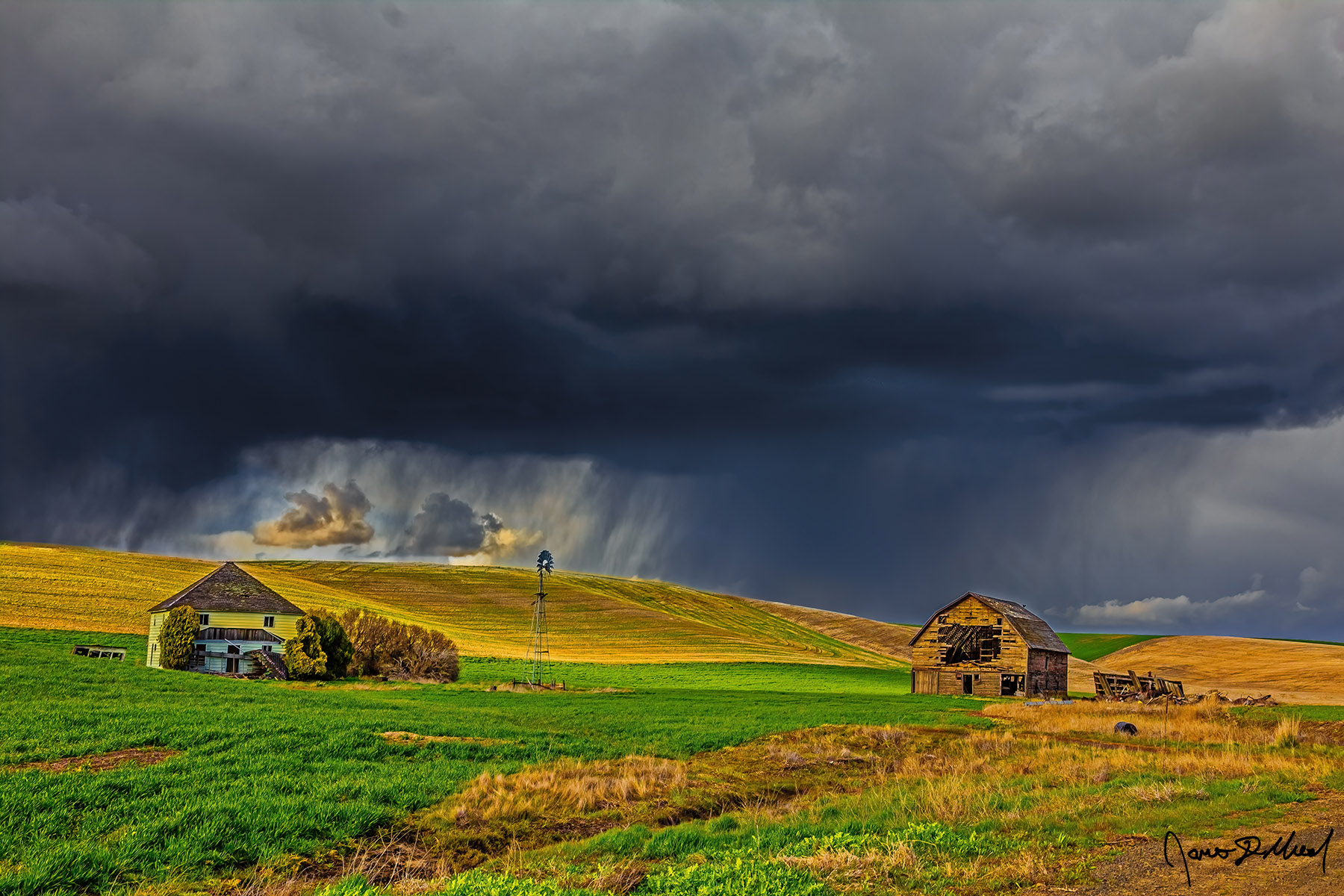 Storm Break A Squall Line drenches the ridge just above an abandoned farm as sunshine peaks through a break in the storm clouds in the Palouse of Eastern, Washington